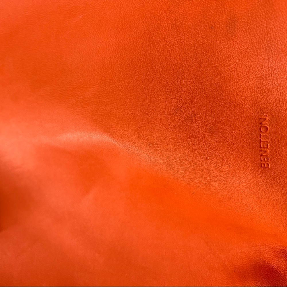 There are some stains on bag. Never used. Stayed on the closet for a long time.